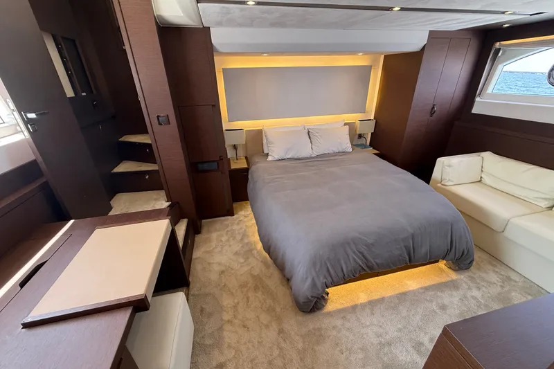 Slide: The Image of Luxurious 2017 Prestige 630 yacht bedroom with modern decor and ambient lighting. - 28
