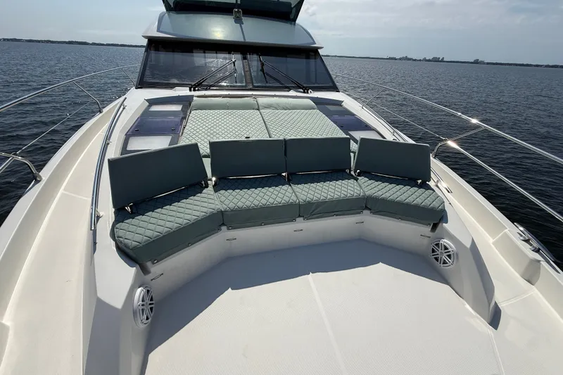 Slide: The Image of Luxurious 2017 Prestige 630 yacht with spacious deck seating on calm waters. - 14