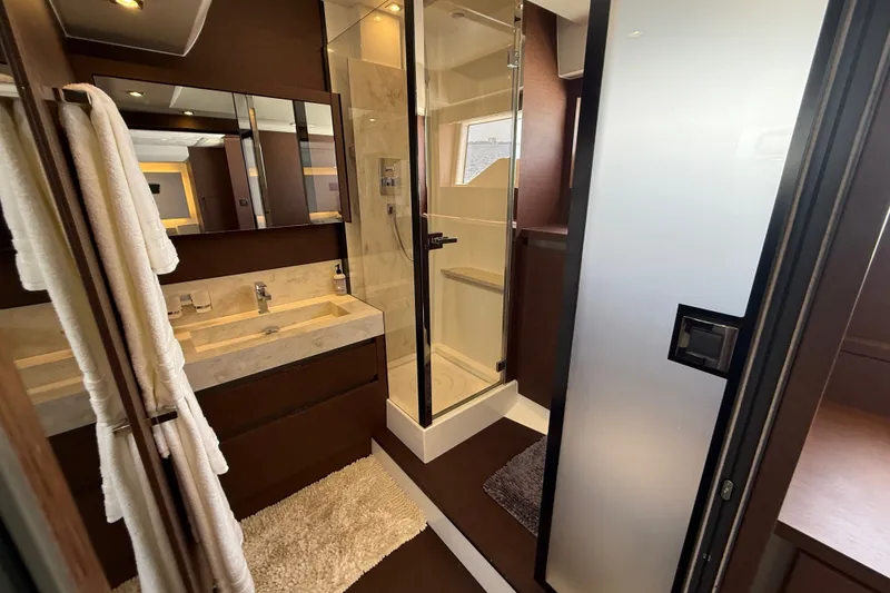 Slide: The Image of Luxurious bathroom in 2017 Prestige 630 yacht with modern fixtures and elegant design. - 32