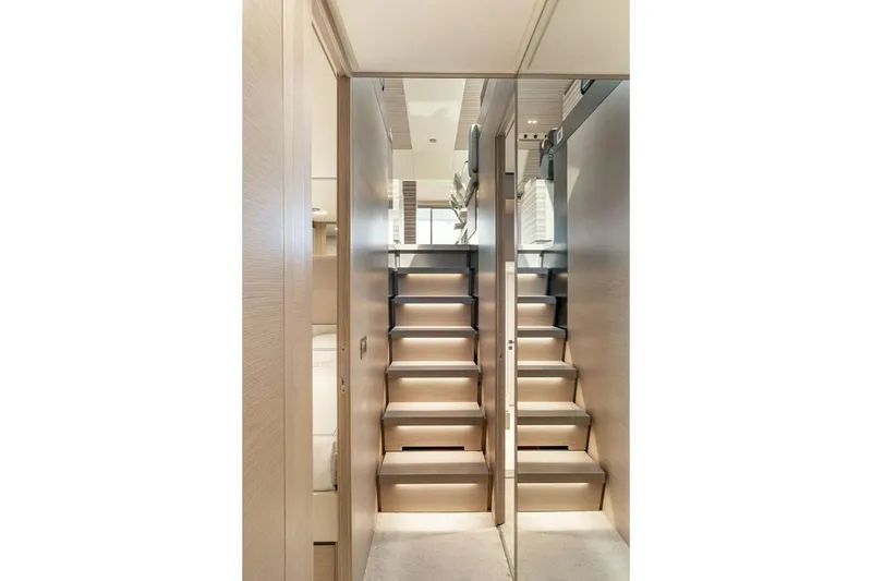 Slide: The Image of Staircase inside 2020 Ferretti Yachts 670, featuring modern design and sleek wood finish. - 44