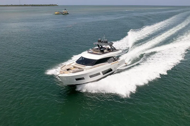 Slide: The Image of Luxury 2020 Ferretti Yachts 670 cruising on open water, showcasing sleek design and performance. - 4
