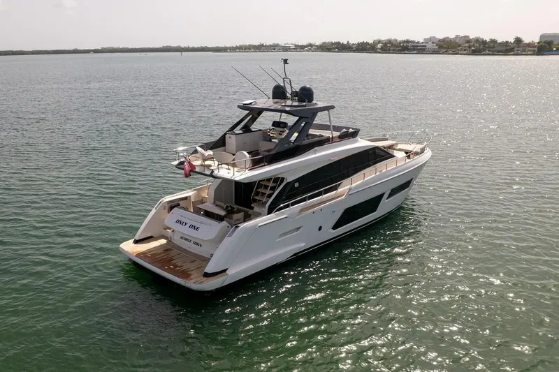 Slide: The Image of 2020 Ferretti Yachts 670 cruising on calm waters, showcasing sleek design and luxury. - 9