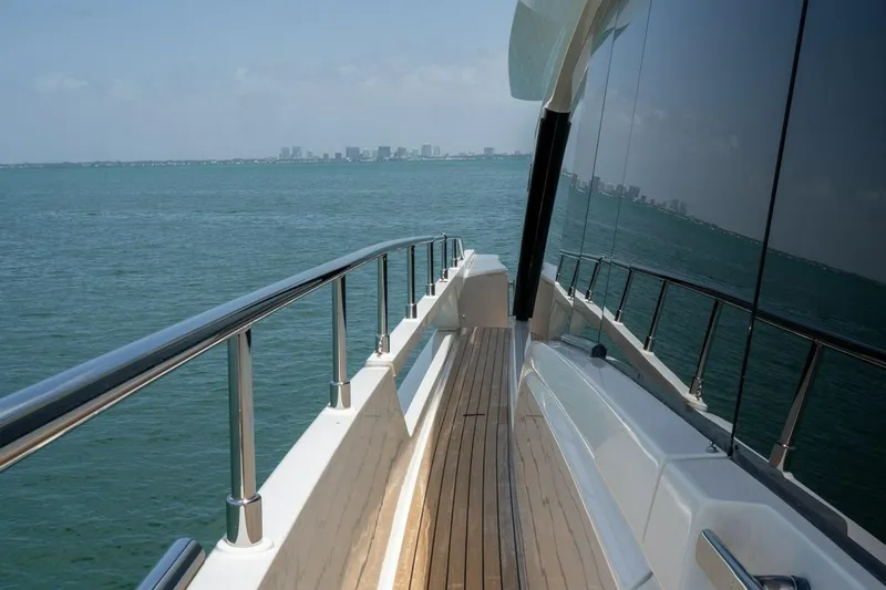 Slide: The Image of Side deck view of 2020 Ferretti Yachts 670 cruising on open water. - 15