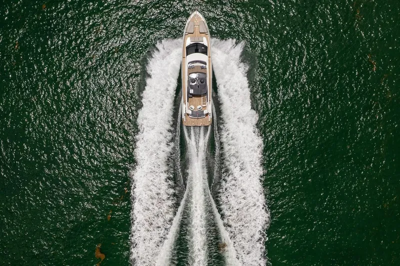 Slide: The Image of Aerial view of 2020 Ferretti Yachts 670 cruising on open water. - 6
