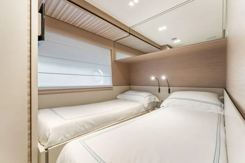Slide: The Image of Interior of 2020 Ferretti Yachts 670 featuring twin beds in a modern cabin. - 66