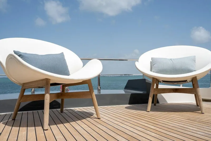Slide: The Image of Luxurious deck seating on 2020 Ferretti Yachts 670, overlooking serene ocean view. - 18