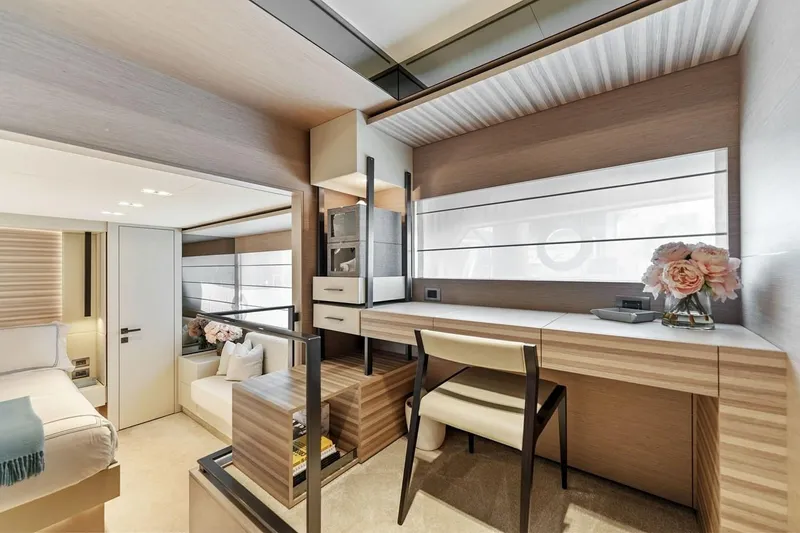Slide: The Image of Luxurious interior of 2020 Ferretti Yachts 670, featuring elegant wood finishes and modern decor. - 49