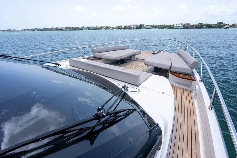 Slide: The Image of Luxurious 2020 Ferretti Yachts 670 with spacious deck and elegant seating on open water. - 11