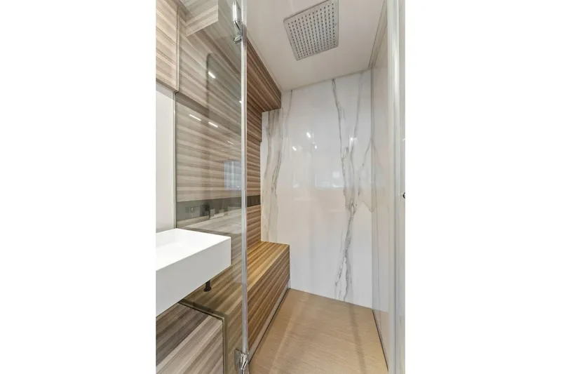 Slide: The Image of Luxurious bathroom interior of 2020 Ferretti Yachts 670 with modern design and marble accents. - 54