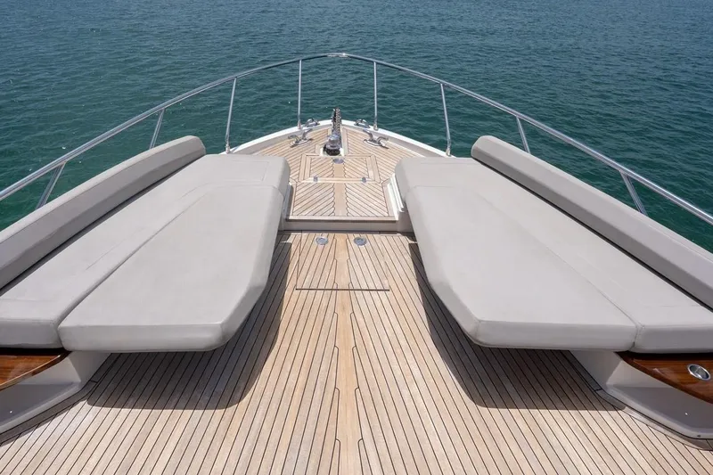 Slide: The Image of Luxurious 2020 Ferretti Yachts 670 deck with sun loungers overlooking the ocean. - 12