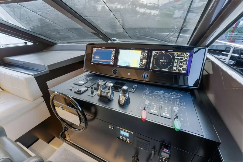 Slide: The Image of Cockpit of 2020 Ferretti Yachts 670 with advanced navigation controls and displays. - 43