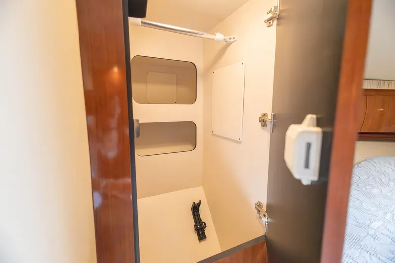 Slide: The Image of Interior storage compartment on a 2005 Sea Ray 420 Sundancer yacht. - 14