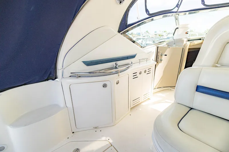 Slide: The Image of Interior of 2005 Sea Ray 420 Sundancer yacht with white seating and cabinetry. - 33