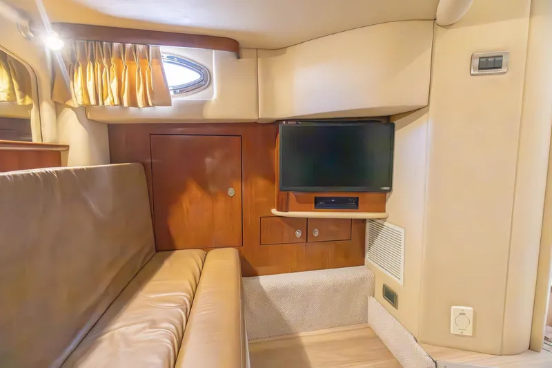 Slide: The Image of Interior of 2005 Sea Ray 420 Sundancer yacht with TV and seating area. - 25