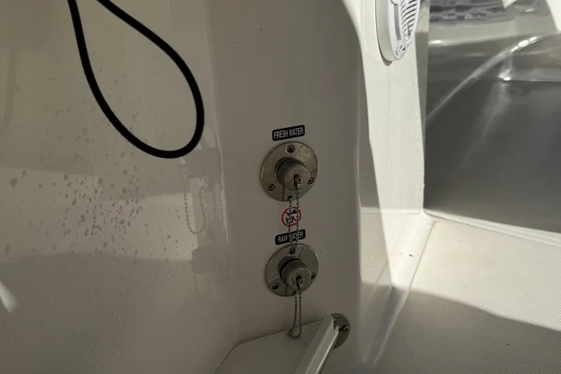 Slide: The Image of Fresh and raw water inlets on 2021 Boston Whaler 250 Outrage boat. - 16