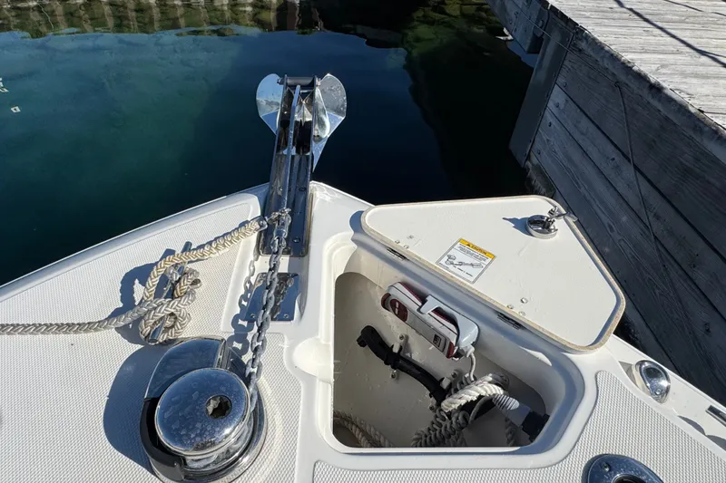 Slide: The Image of Bow of 2021 Boston Whaler 250 Outrage with anchor and storage compartment. - 26
