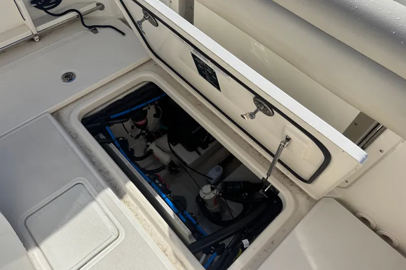 Slide: The Image of Open storage compartment on a 2021 Boston Whaler 250 Outrage boat deck. - 8