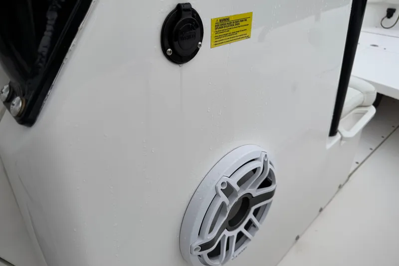 Slide: The Image of 2022 Everglades 243 Center Console boat speaker and warning label detail. - 19
