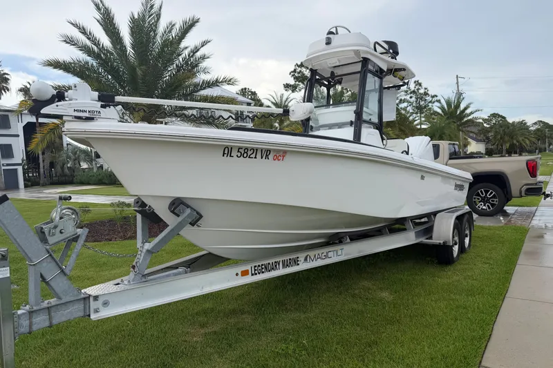 The Image of 2022 Everglades 243 Center Console boat on trailer, parked outdoors. - 0
