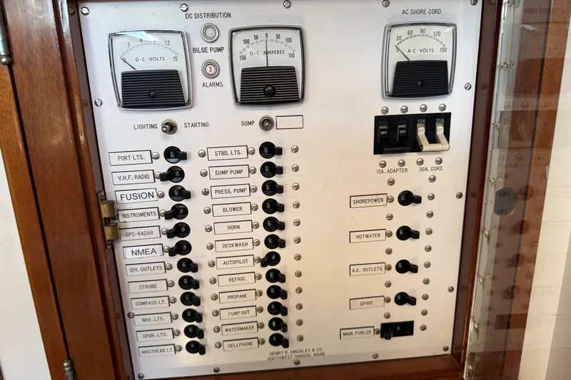 Slide: The Image of Electrical control panel on a 1984 Hinckley Sou'wester 42 yacht, featuring various switches and gauges. - 30