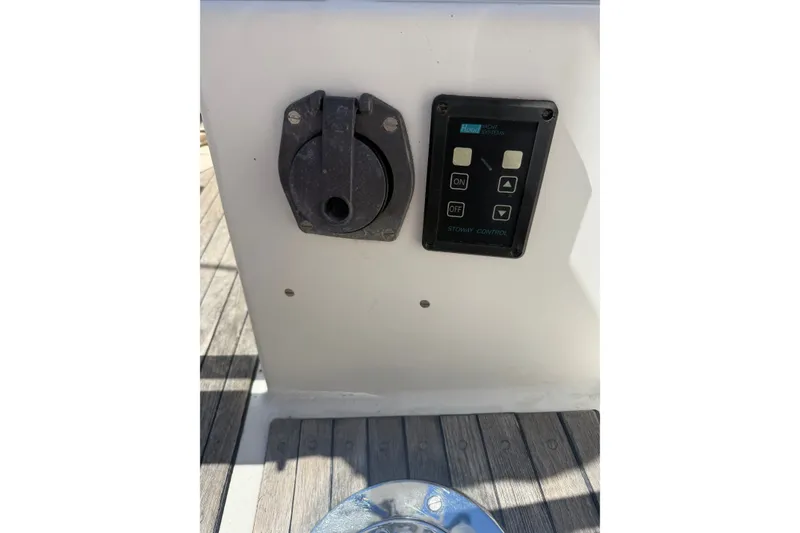Slide: The Image of Control panel on 1984 Hinckley Sou'wester 42 yacht deck, featuring switches and buttons. - 28