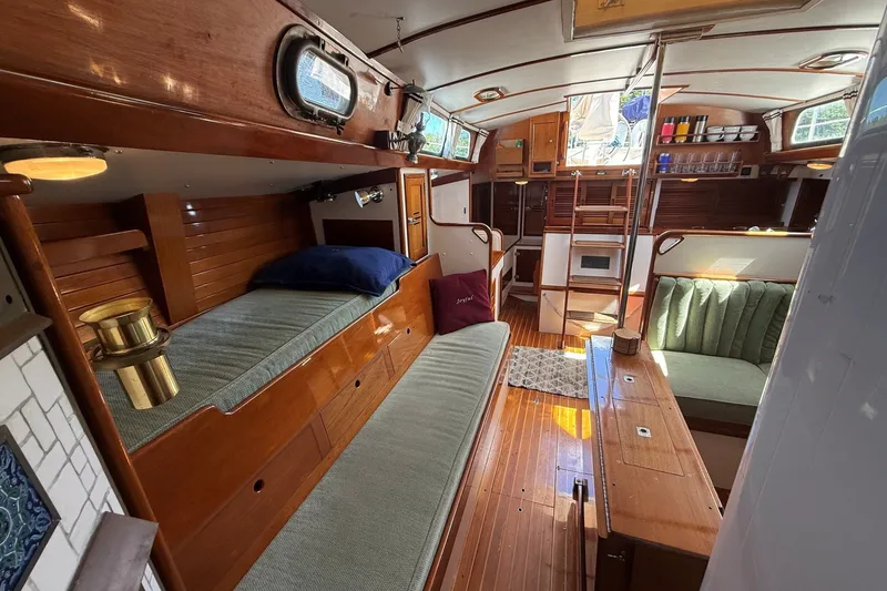 Slide: The Image of Interior of 1984 Hinckley Sou'wester 42 sailboat with wooden furnishings and cozy seating. - 47