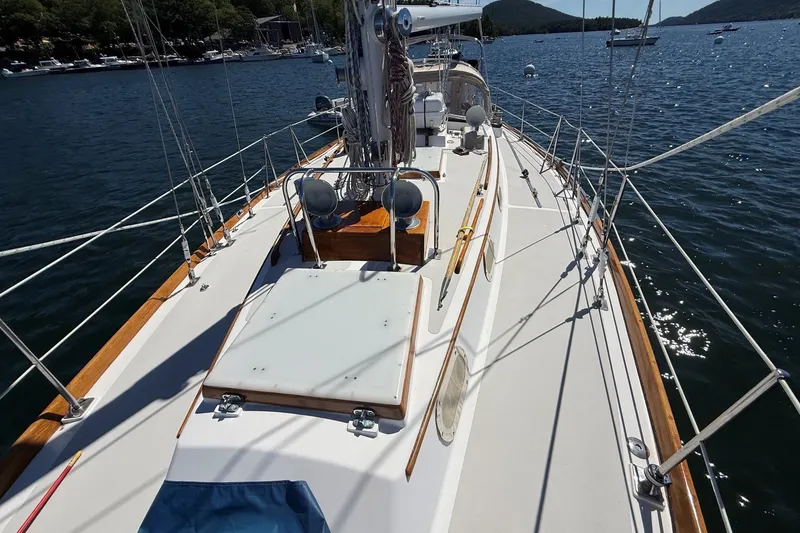 Slide: The Image of 1984 Hinckley Sou'wester 42 sailboat deck with scenic water view. - 19