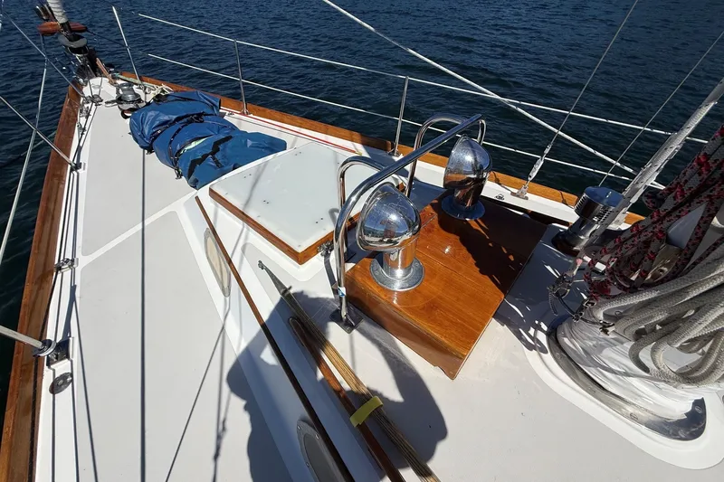 Slide: The Image of Deck of 1984 Hinckley Sou'wester 42 sailboat with polished wood and chrome fittings. - 15