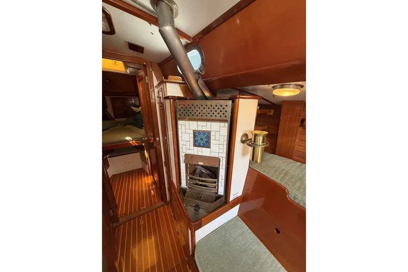 Slide: The Image of Interior of 1984 Hinckley Sou'wester 42 sailboat with wood paneling and cozy cabin features. - 44