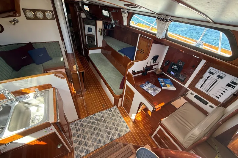 Slide: The Image of Interior of 1984 Hinckley Sou'wester 42 sailboat with wood finishes and navigation station. - 35