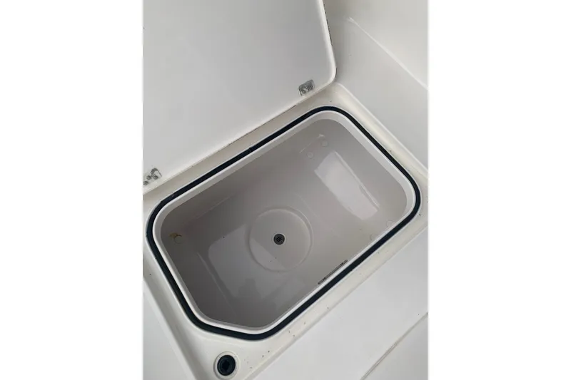 Slide: The Image of Open storage compartment on 2020 Caymas 26 HB boat. - 11