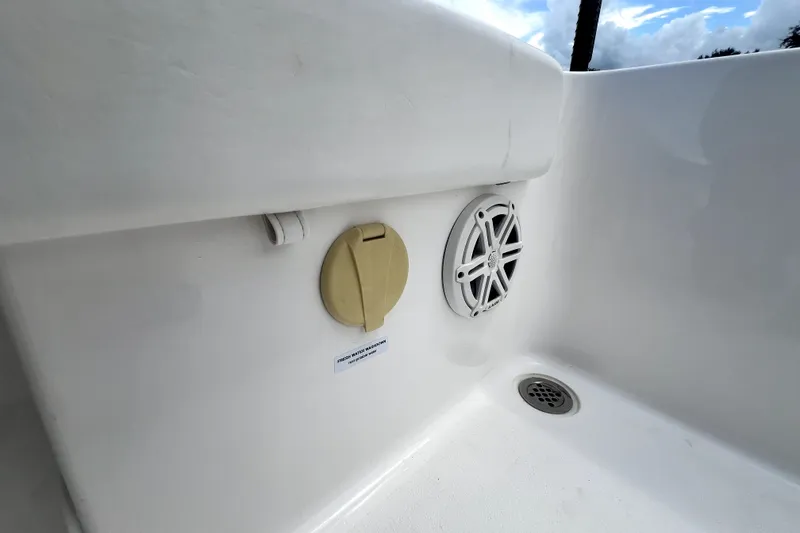 Slide: The Image of 2020 Caymas 26 HB boat interior with speaker and drainage system. - 82