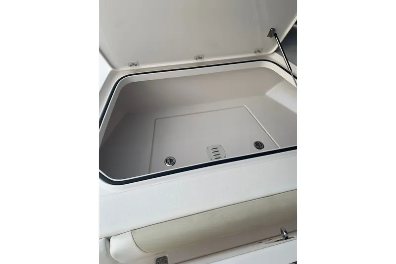 Slide: The Image of Open storage compartment on 2020 Caymas 26 HB boat. - 12