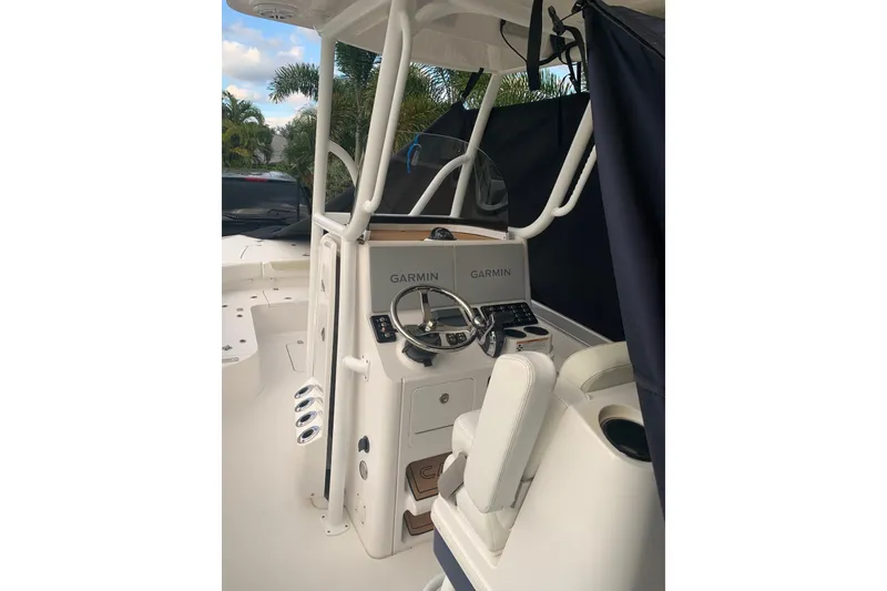 Slide: The Image of 2020 Caymas 26 HB boat helm with Garmin electronics and comfortable seating. - 1