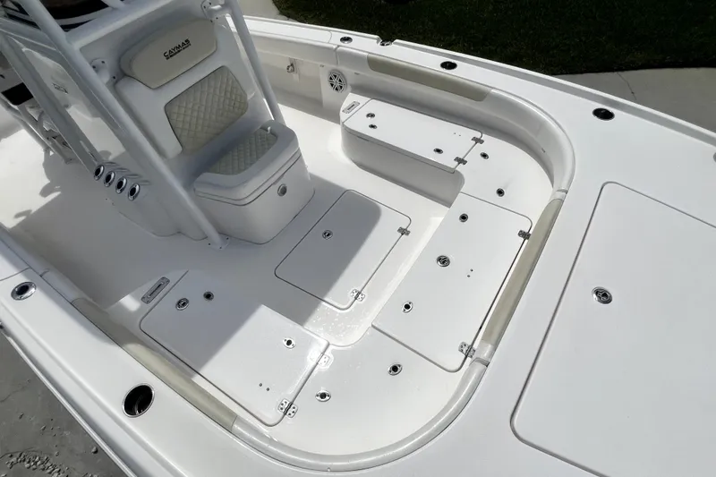Slide: The Image of 2020 Caymas 26 HB boat interior with seating and storage compartments. - 55