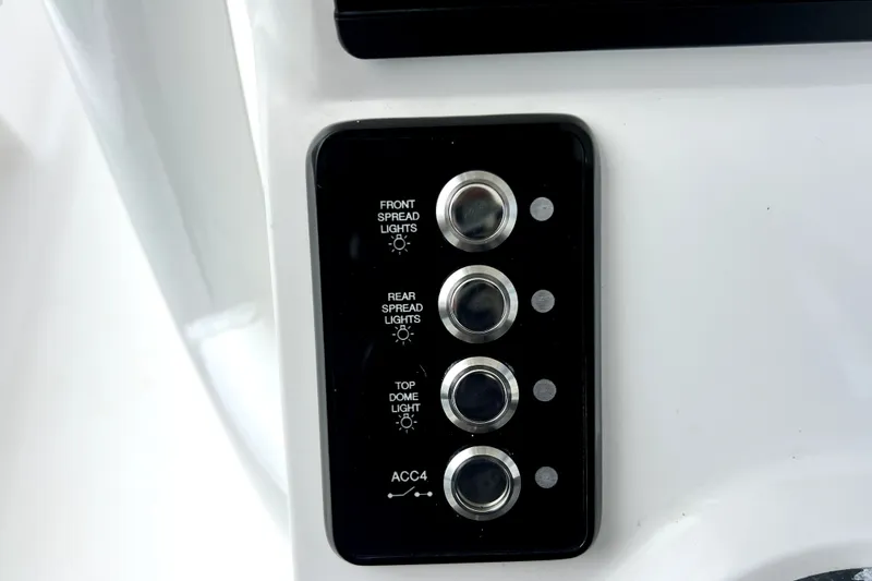 Slide: The Image of Control panel of 2020 Caymas 26 HB boat with light switches. - 34