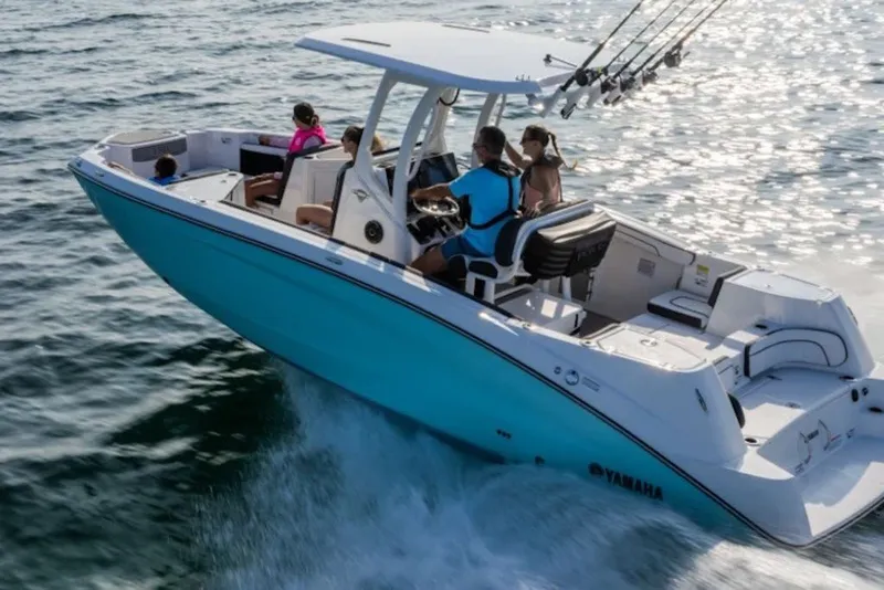 Slide: The Image of 2027 Yamaha Boats 222 FSH Sport E cruising on open water with passengers. - 6