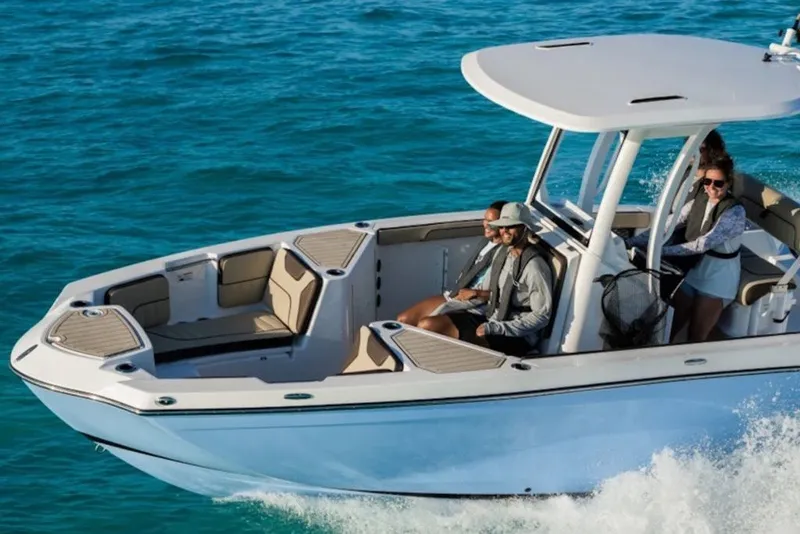 Slide: The Image of 2027 Yamaha Boats 222 FSH Sport E cruising on clear blue water. - 1