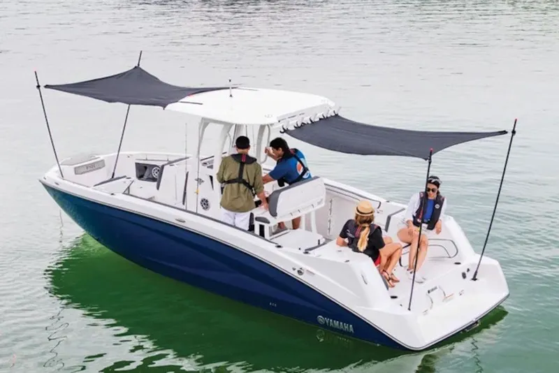 Slide: The Image of 2027 Yamaha Boats 252 FSH® SPORT on water with passengers enjoying leisure time. - 1