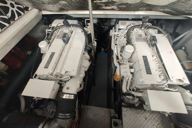 Slide: The Image of Engine room of a 1998 Sea Ray Sundancer 400 with twin diesel engines. - 19