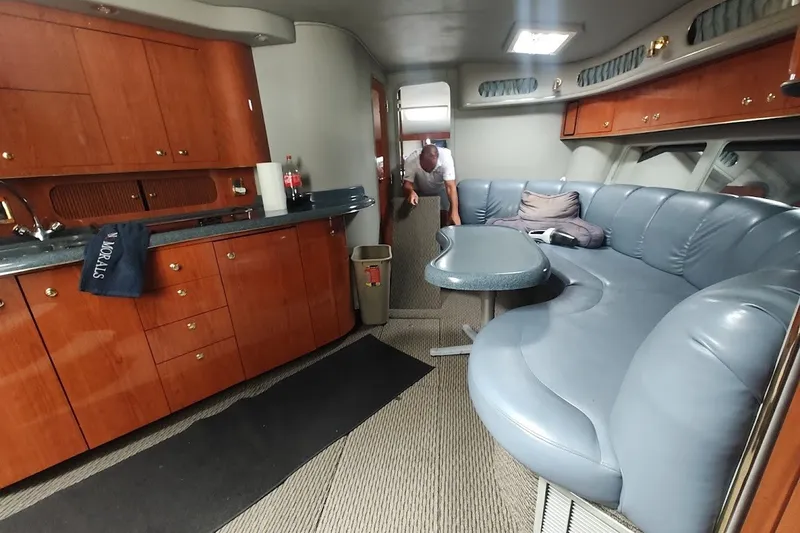 Slide: The Image of Interior of 1998 Sea Ray Sundancer 400 yacht with kitchen and seating area. - 1