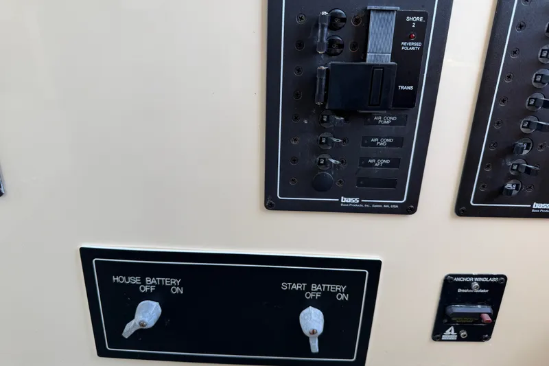 Slide: The Image of Control panel of a 2001 Nordic Tug 32 boat with battery switches and circuit breakers. - 46