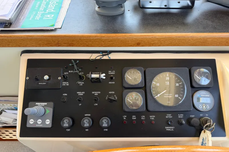 Slide: The Image of Control panel of a 2001 Nordic Tug 32 boat with gauges and switches. - 48