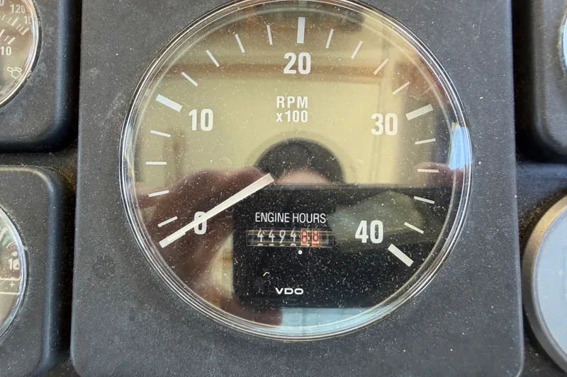 Slide: The Image of Close-up of a Nordic Tug 32 tachometer showing RPM and engine hours. - 47