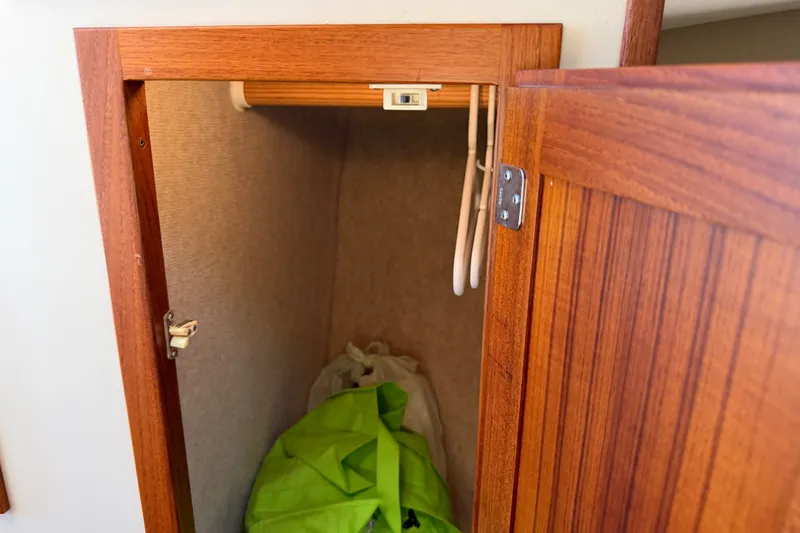 Slide: The Image of Wooden closet interior on a 2001 Nordic Tug 32 boat. - 72