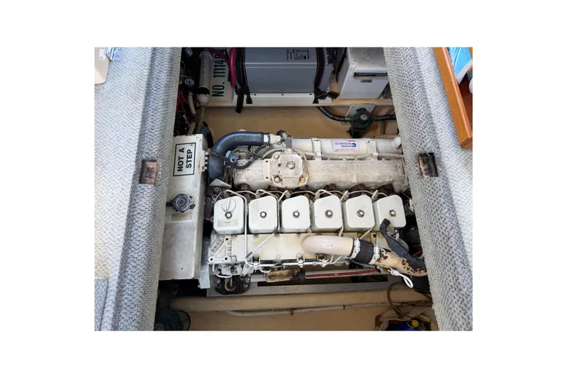 Slide: The Image of Engine compartment of a 2001 Nordic Tug 32, showcasing mechanical components and layout. - 77