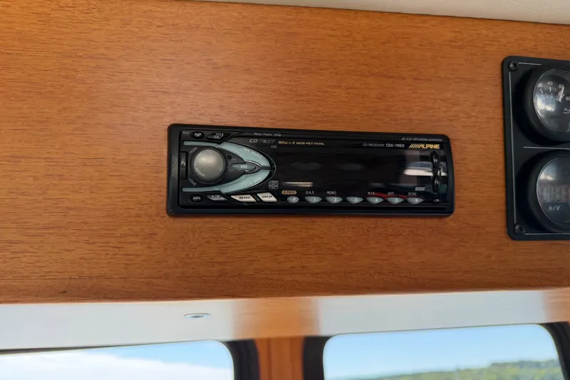 Slide: The Image of Alpine CD receiver in 2001 Nordic Tug 32 boat dashboard. - 44