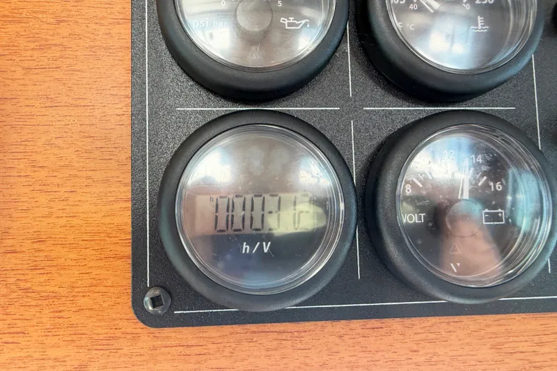 Slide: The Image of Close-up of Nordic Tug 32, 2001 model, dashboard gauges on wooden panel. - 58