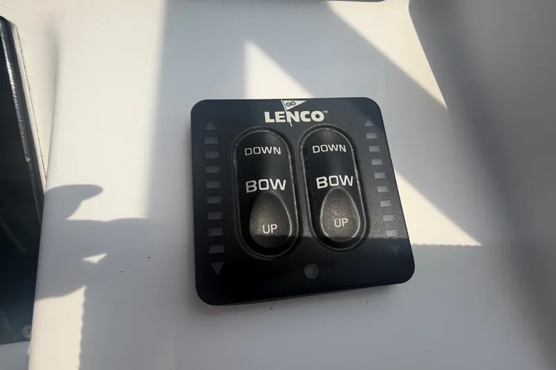 Slide: The Image of Lenco trim tab control panel on 2000 Pro-Line 32 Express boat. - 19