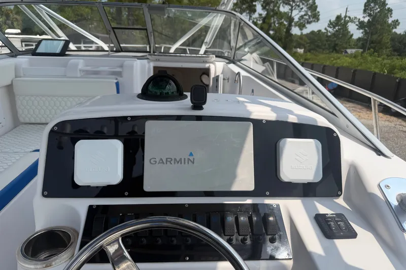 Slide: The Image of Cockpit view of a 2000 Pro-Line 32 Express boat with Garmin navigation system. - 24
